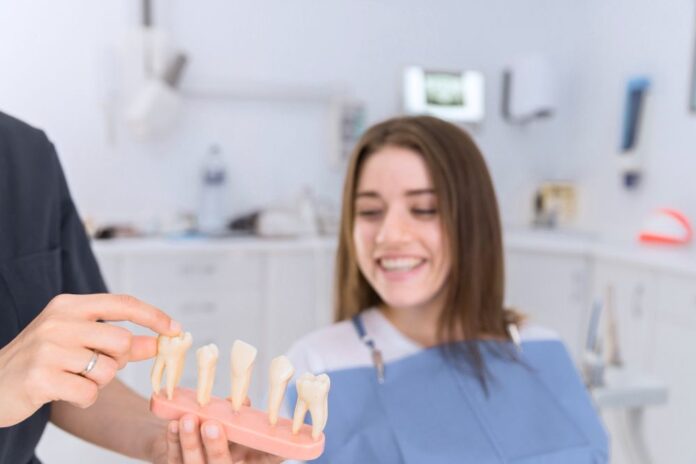 implant dentar stoma urgent